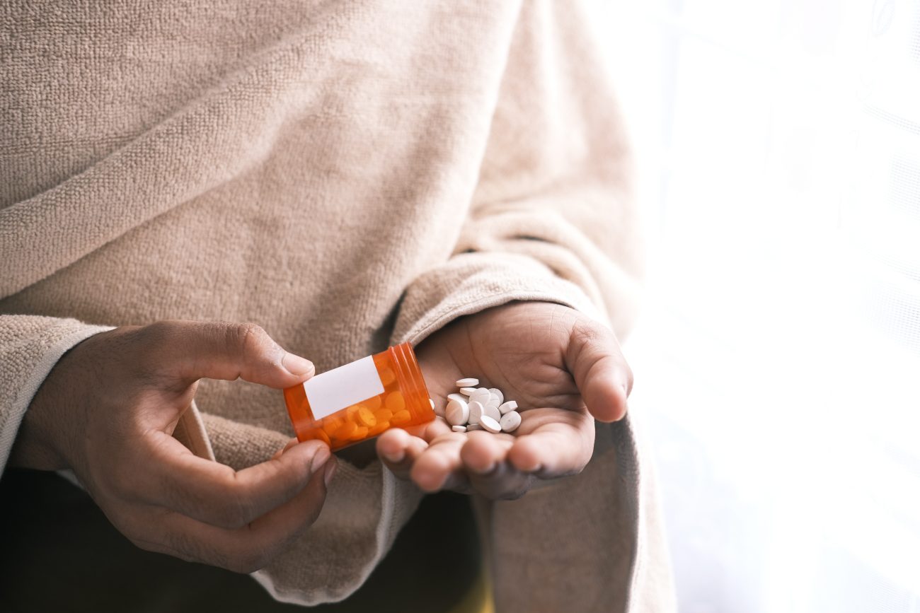 woman holding medication